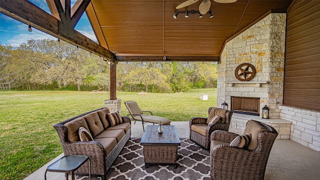 169 Star Point Ln, Weatherford, TX 76088 - view of patio / terrace with an outdoor living space with a fireplace and a ceiling fan
