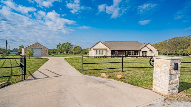 169 Star Point Ln, Weatherford, TX 76088 - view of front of home featuring a garage, a fenced front yard, a front lawn, driveway, and an outbuilding