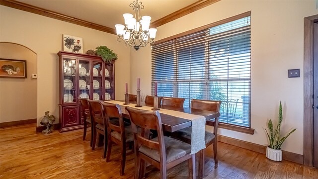 169 Star Point Ln, Weatherford, TX 76088 - dining room featuring baseboards, an inviting chandelier, crown molding, and light wood finished floors