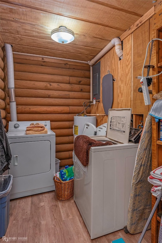 laundry room with light wood-style floors, electric panel, wooden ceiling, log walls, and washer and clothes dryer