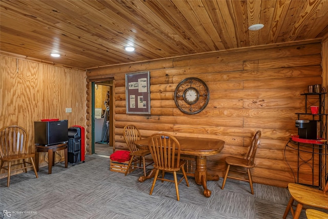 carpeted dining area with wooden ceiling, log walls, and recessed lighting