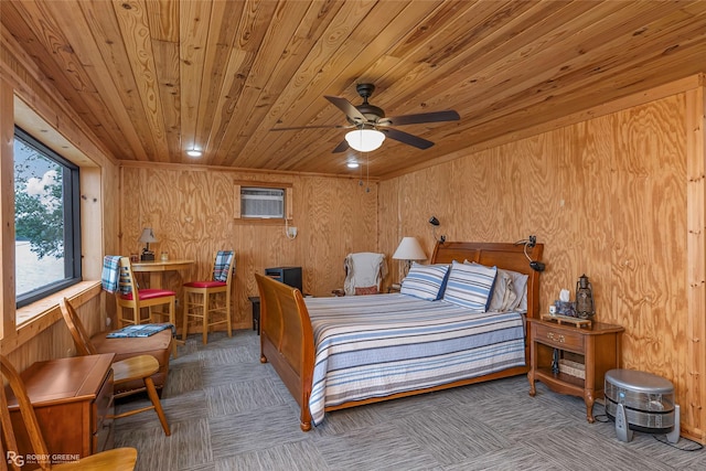 bedroom with an AC wall unit, wood ceiling, wooden walls, and carpet floors