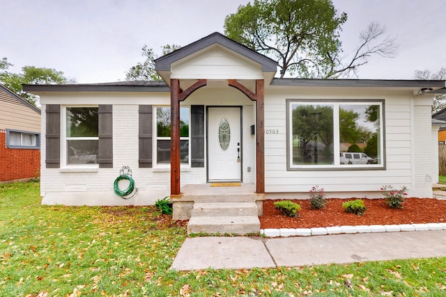10503 Cayuga Dr, Dallas, TX 75228 - view of front of home featuring a front lawn and brick siding