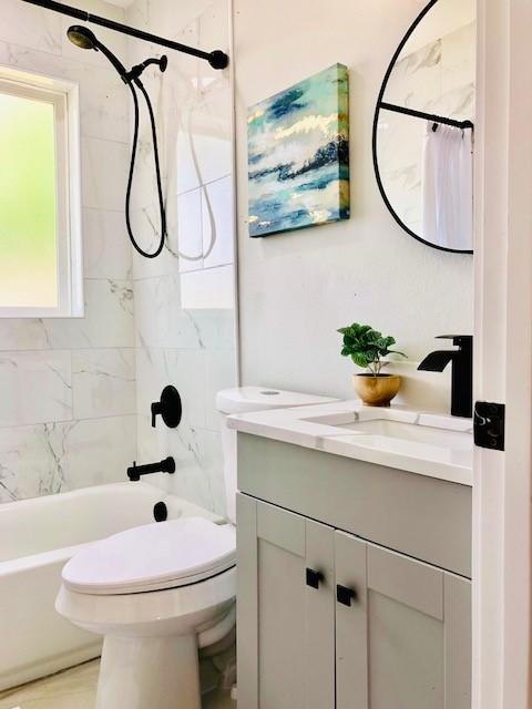10503 Cayuga Dr, Dallas, TX 75228 - full bathroom featuring vanity, shower / tub combo with curtain, and toilet