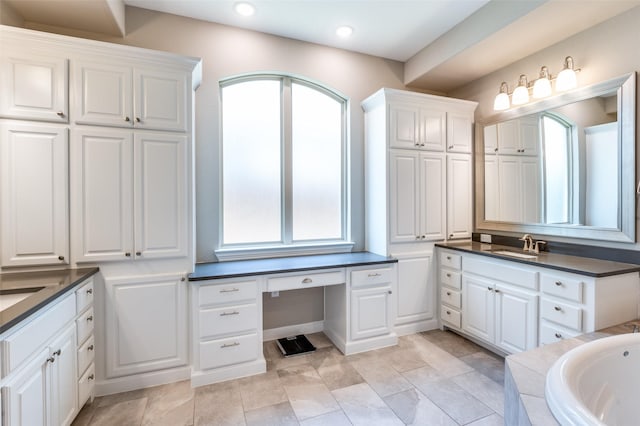 2813 Maverick Way, Celina, TX 75009 - full bath with two vanities, a garden tub, and recessed lighting