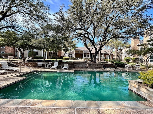 community pool with a patio