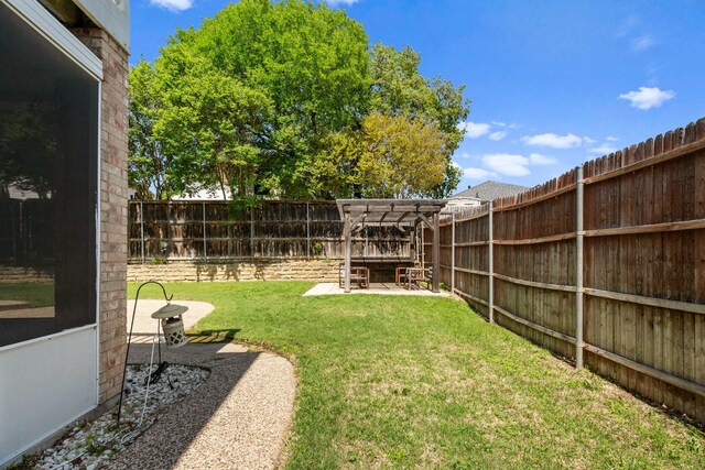 view of yard featuring a patio and a fenced backyard