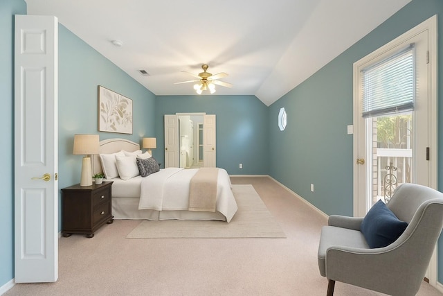bedroom featuring visible vents, baseboards, light colored carpet, and vaulted ceiling