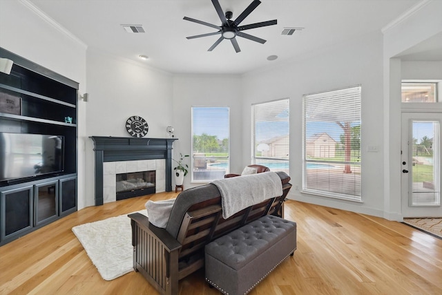 809 Chiswick Ct, Haslet, TX 76052 - living room with ceiling fan, wood finished floors, a fireplace, and crown molding