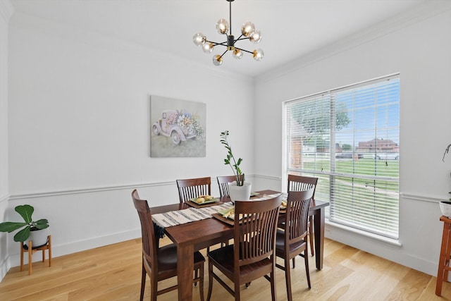 809 Chiswick Ct, Haslet, TX 76052 - dining area with a chandelier, crown molding, light wood finished floors, and baseboards