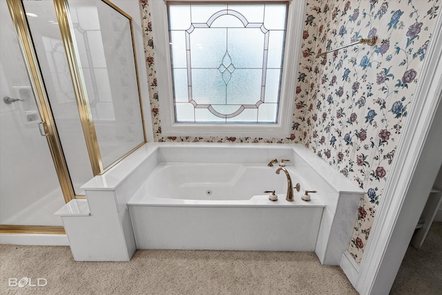 bathroom with a bath, carpet flooring, wallpapered walls, and a shower stall