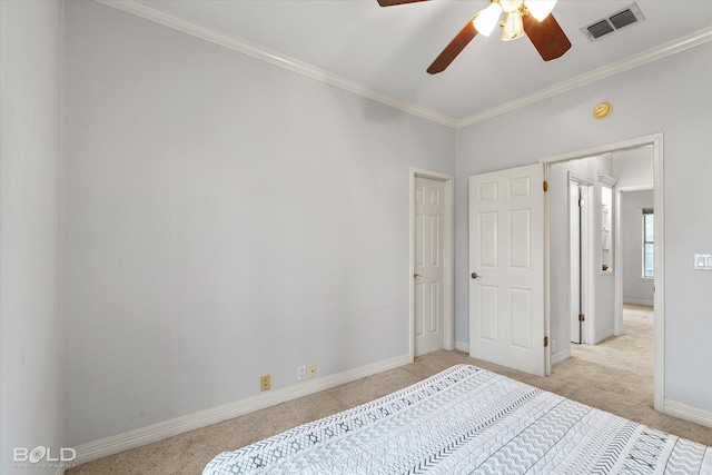 bedroom with baseboards, visible vents, crown molding, and light carpet