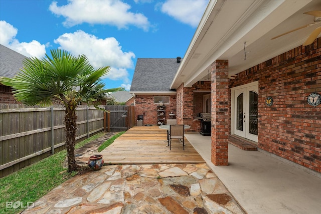 view of patio featuring french doors and fence