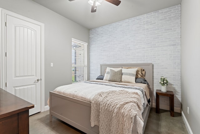 14088 Windrow Dr, Talty, TX 75126 - bedroom with an accent wall, baseboards, concrete floors, and a ceiling fan