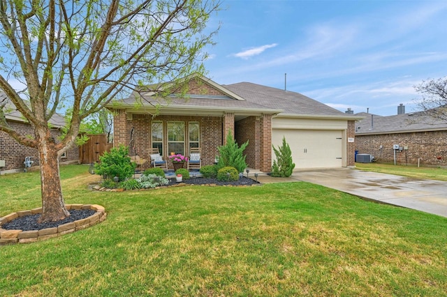 view of front of property with concrete driveway, fence, an attached garage, a front yard, and brick siding