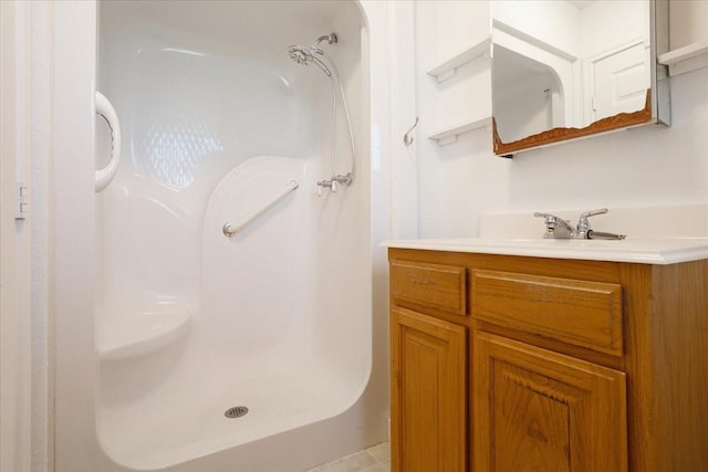 bathroom featuring vanity and a stall shower
