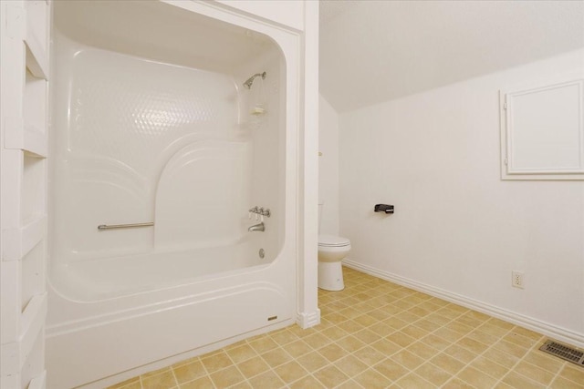 bathroom featuring visible vents, baseboards, toilet, tile patterned floors, and bathtub / shower combination