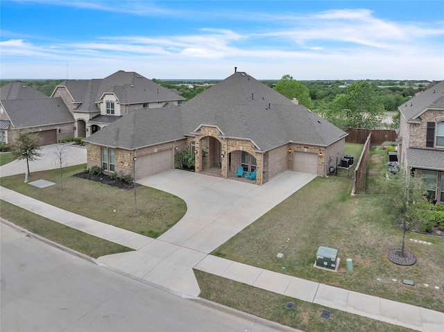 view of front of house with brick siding, an attached garage, roof with shingles, and driveway