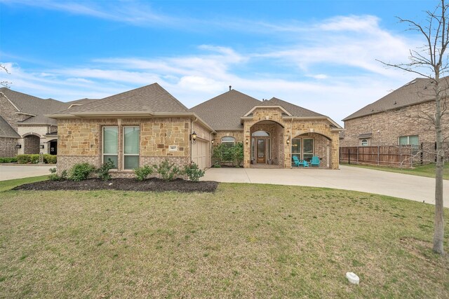 9857 La Frontera Dr, Fort Worth, TX 76179 - french country home with driveway, brick siding, an attached garage, and roof with shingles