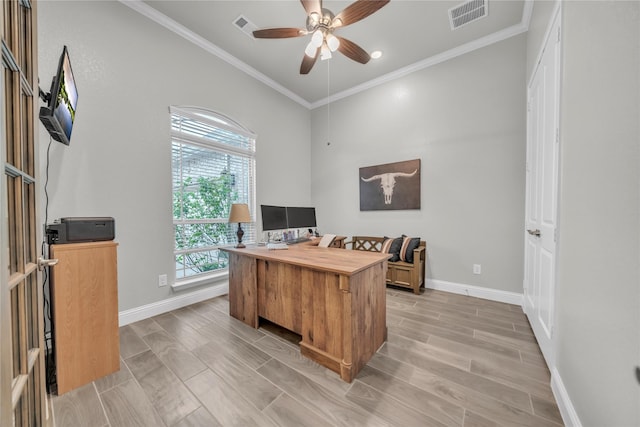 office space with a ceiling fan, baseboards, ornamental molding, and visible vents