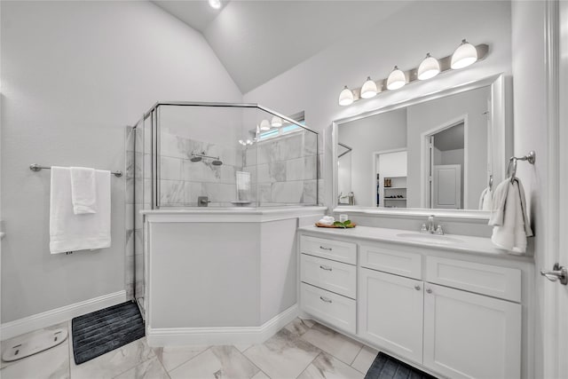 full bath with vaulted ceiling, vanity, marble finish floor, and tiled shower