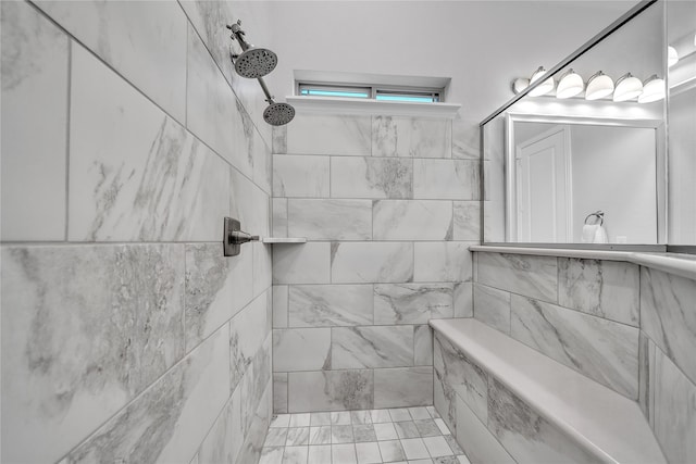 full bathroom with tiled shower