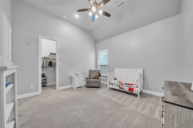bedroom featuring light carpet, baseboards, visible vents, a ceiling fan, and high vaulted ceiling