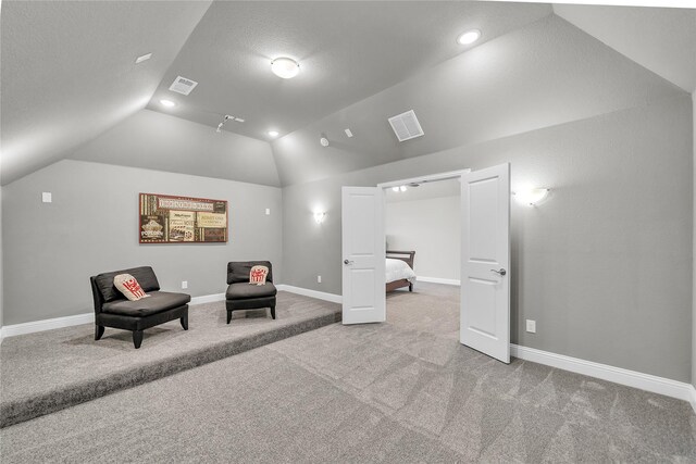 living area featuring recessed lighting, lofted ceiling, visible vents, carpet floors, and baseboards