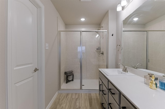 2728 Baneberry Ln, Mesquite, TX 75150 - full bath with a stall shower, wood finished floors, vanity, and baseboards