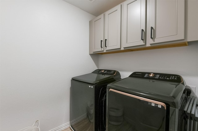 2728 Baneberry Ln, Mesquite, TX 75150 - laundry area with washing machine and dryer and cabinet space