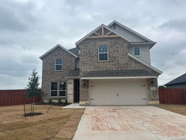 view of front of house featuring brick siding, fence, board and batten siding, and concrete driveway