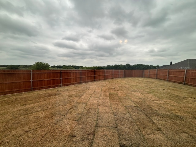 view of yard with a fenced backyard