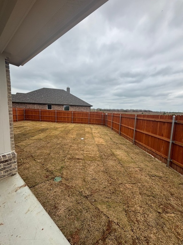 view of yard featuring a fenced backyard