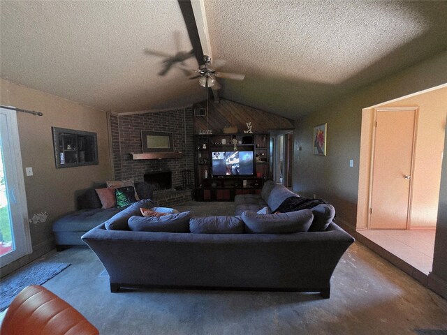 living area featuring a textured ceiling, lofted ceiling, a ceiling fan, and a brick fireplace