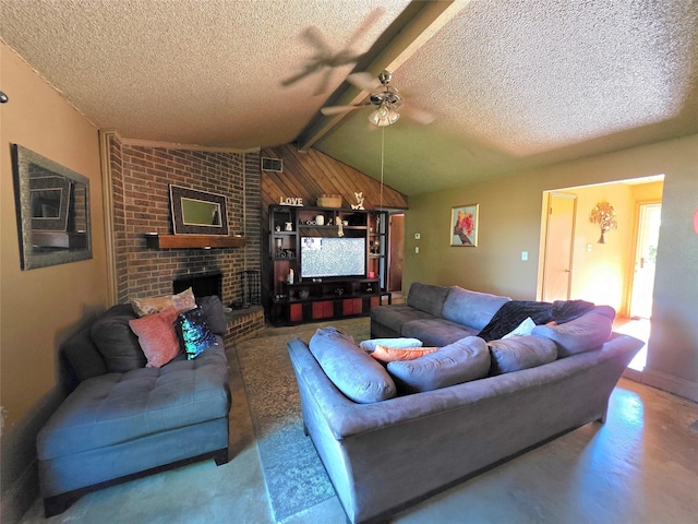 living room with a ceiling fan, lofted ceiling with beams, a brick fireplace, and a textured ceiling