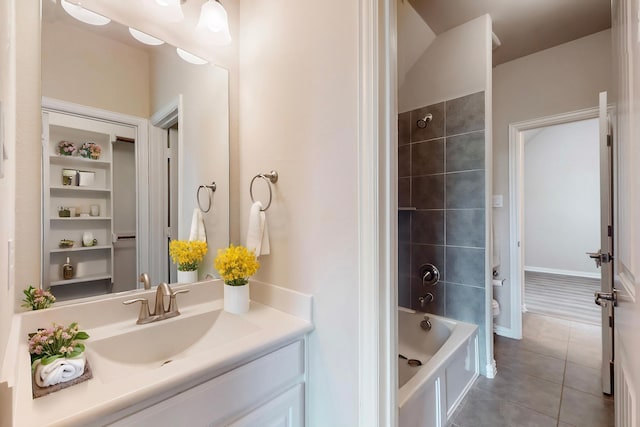 bathroom with toilet, tile patterned floors, bathtub / shower combination, and vanity