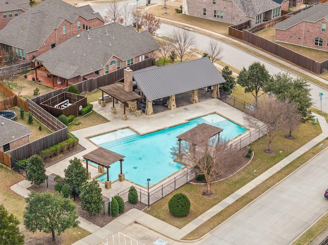 community pool featuring a gazebo, a fenced backyard, and a patio area