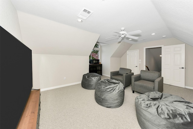 living area with lofted ceiling, visible vents, baseboards, recessed lighting, and carpet