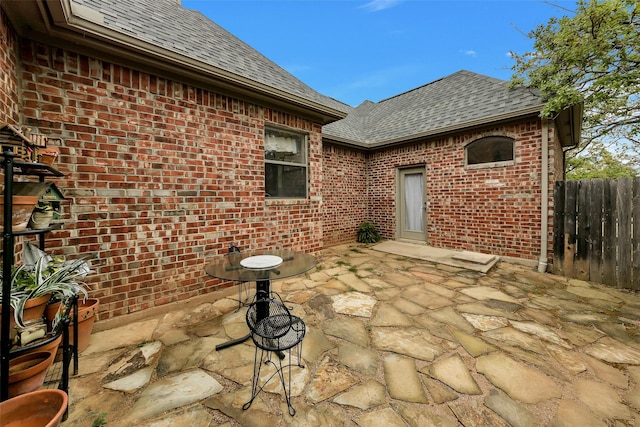 view of patio / terrace featuring fence
