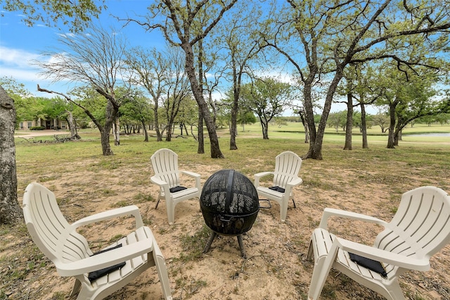 view of yard with an outdoor fire pit