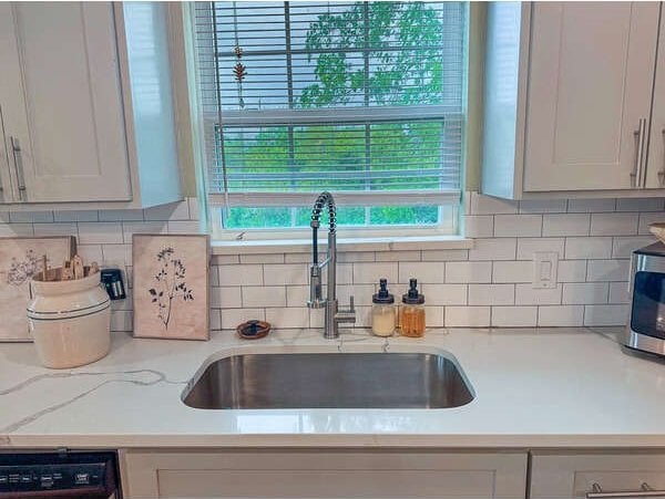 100 Winchester Cir, Gun Barrel City, TX 75156 - kitchen with backsplash, a sink, white cabinets, dishwashing machine, and light stone countertops