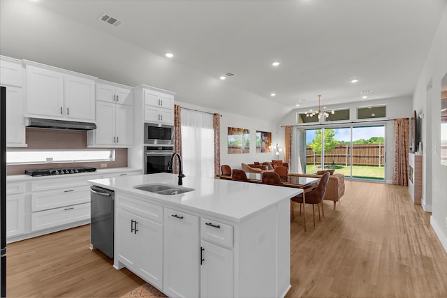 3432 Loftwood Ln, Anna, TX 75409 - kitchen featuring stainless steel appliances, a sink, under cabinet range hood, a chandelier, and light countertops