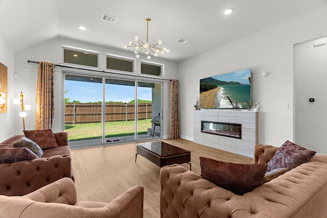3432 Loftwood Ln, Anna, TX 75409 - living area with a chandelier, a fireplace, wood finished floors, recessed lighting, and lofted ceiling