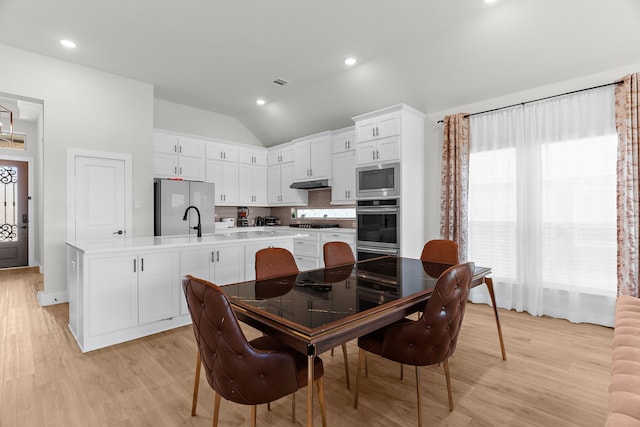 3432 Loftwood Ln, Anna, TX 75409 - dining space with vaulted ceiling, light wood-type flooring, and recessed lighting