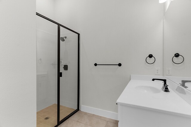 3432 Loftwood Ln, Anna, TX 75409 - bathroom featuring a shower stall, vanity, tile patterned floors, and baseboards