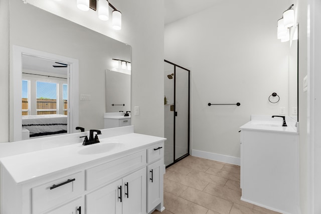 3432 Loftwood Ln, Anna, TX 75409 - bathroom with ensuite bath, a shower stall, two vanities, tile patterned flooring, and baseboards