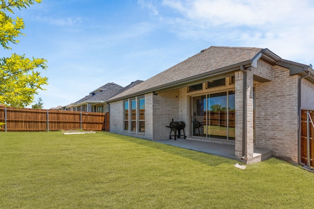 3432 Loftwood Ln, Anna, TX 75409 - rear view of house with brick siding, a shingled roof, and a patio area