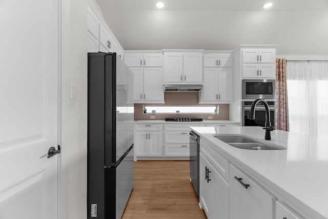 3432 Loftwood Ln, Anna, TX 75409 - kitchen featuring stainless steel appliances, a sink, white cabinets, light countertops, and recessed lighting