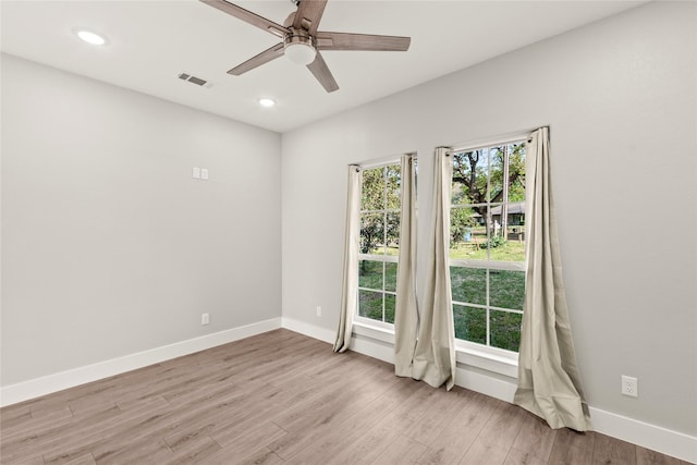 unfurnished room with light wood-type flooring, baseboards, visible vents, ceiling fan, and recessed lighting
