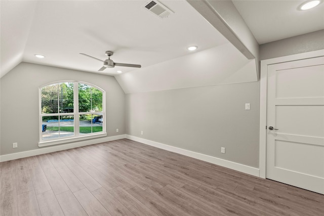 empty room with wood finished floors, visible vents, baseboards, and ceiling fan